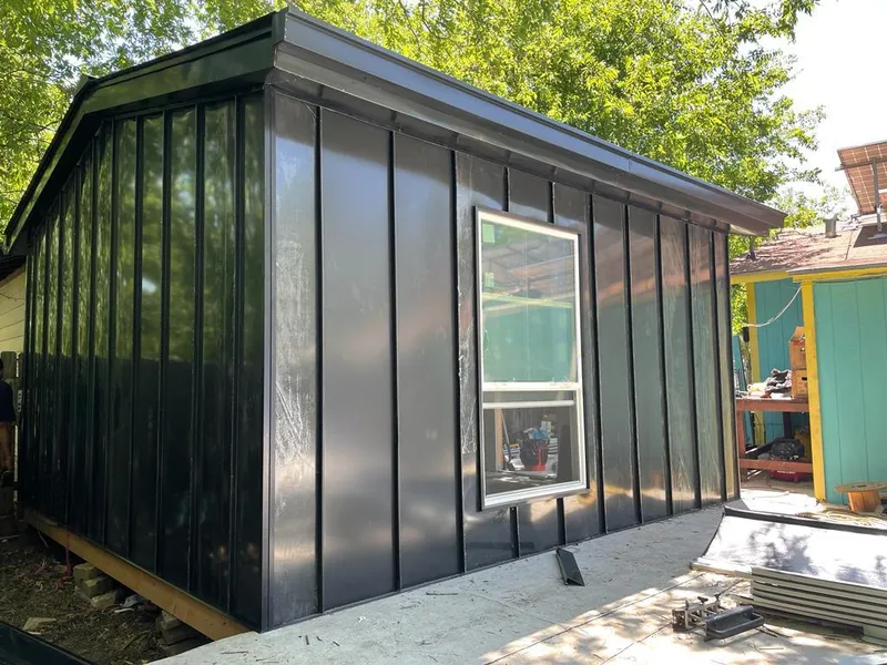 Black standing seam metal wall panels for Metal Roof Installation in North Alamo