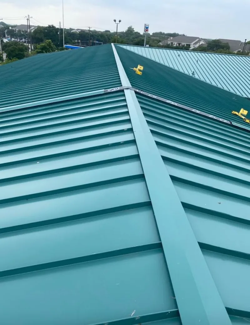 Green commercial metal roof ridge and valley for Metal Roof Repair in North Alamo