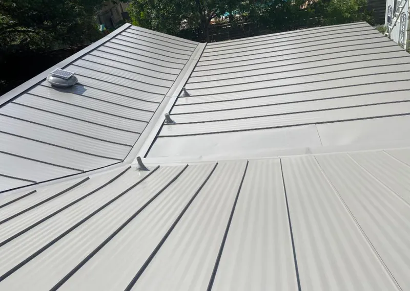 Solar attic fan installed on a metal roof for Roof Ventilation in North Alamo